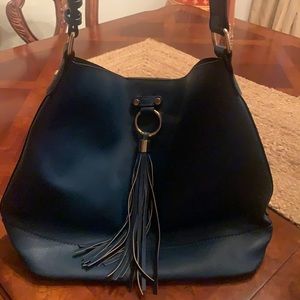 Blue leather handbag . Barely used .